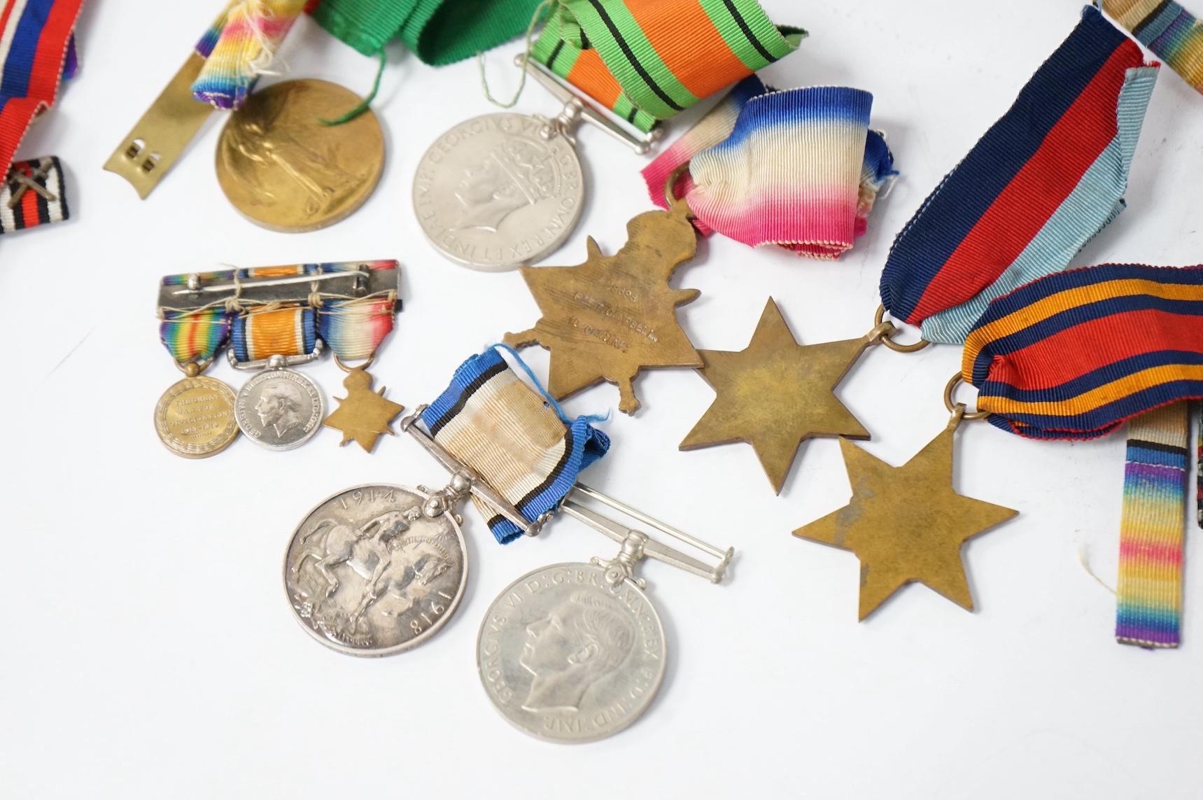 A collection of military medals, shoulder titles, whistles, etc. including; a WWI medal trio to 19698 PTE. T. Campbell. 10-CAN. INF., a miniature trio, four WWII medals; the Burma Star, the 1939-1945 Star, the Defence Me
